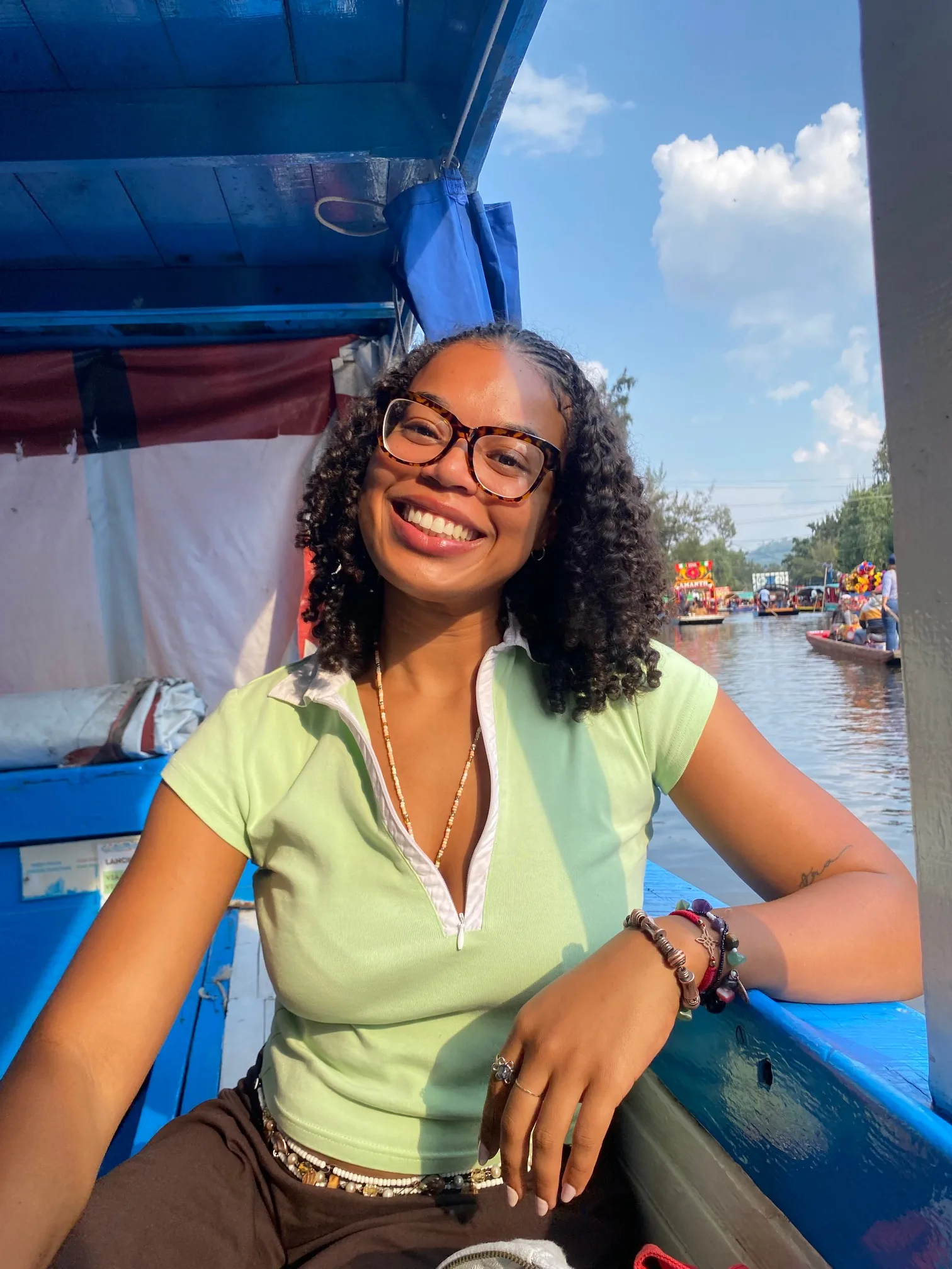 Lexi Lee smiling on a boat